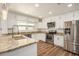 Updated kitchen with stainless steel appliances, granite counters and bright cabinets at 3441 E Taylor St, Phoenix, AZ 85008