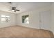 Spacious living room featuring a ceiling fan and natural light at 3441 E Taylor St, Phoenix, AZ 85008