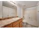 A full bathroom featuring a vanity, a mirror, and a shower over tub at 3810 N Maryvale Pkwy # 1059, Phoenix, AZ 85031