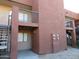 A view of the exterior of the building showing a covered patio and balconies at 3810 N Maryvale Pkwy # 1059, Phoenix, AZ 85031