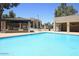 Apartment community featuring a pool with a nearby grill and picnic area at 3810 N Maryvale Pkwy # 1059, Phoenix, AZ 85031