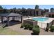 Community pool featuring a pergola, sun deck, and basketball court at 3810 N Maryvale Pkwy # 1059, Phoenix, AZ 85031