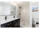 Modern bathroom featuring double sink vanity, and stylish tiled shower at 3822 W Flower St, Phoenix, AZ 85019