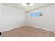 Cozy bedroom with ample natural light and plush carpet flooring at 3822 W Flower St, Phoenix, AZ 85019