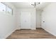 Bright bedroom featuring wood-style flooring, closet and modern lighting at 3822 W Flower St, Phoenix, AZ 85019