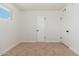 Cozy bedroom features carpet flooring, neutral walls, and natural light at 3822 W Flower St, Phoenix, AZ 85019
