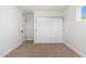 Bedroom with carpet flooring, closet and a large window at 3822 W Flower St, Phoenix, AZ 85019