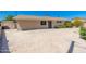 Expansive front yard showcasing a wide driveway and neat landscaping, providing a welcoming entrance at 3822 W Flower St, Phoenix, AZ 85019