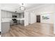 Bright kitchen with gray cabinets, stainless steel appliances and wood-look floors at 3822 W Flower St, Phoenix, AZ 85019