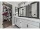 Bathroom boasts double vanity with framed mirrors and a large walk-in closet provides ample storage at 3856 E Encinas Ave, Gilbert, AZ 85234