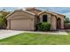 Close-up of a single-story house exterior showcasing architectural details and landscaping at 3856 E Encinas Ave, Gilbert, AZ 85234