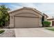 Single-story home showing a two-car garage and a concrete driveway at 3856 E Encinas Ave, Gilbert, AZ 85234
