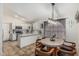 Open kitchen and dining area featuring a breakfast bar and stylish light fixtures at 3856 E Encinas Ave, Gilbert, AZ 85234