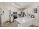 Bright kitchen with white cabinetry, stainless steel appliances, and modern countertops at 3856 E Encinas Ave, Gilbert, AZ 85234