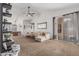 Open-concept living room with vaulted ceilings, a ceiling fan, and a sliding glass door at 3856 E Encinas Ave, Gilbert, AZ 85234