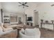 Spacious living room with neutral tones, a ceiling fan, carpet, and comfortable seating at 3856 E Encinas Ave, Gilbert, AZ 85234