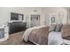 Bedroom featuring a plush bed with warm-toned bedding, leading to the bathroom at 3856 E Encinas Ave, Gilbert, AZ 85234