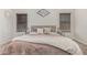 Neutral bedroom featuring a plush bed with warm-toned bedding and decor at 3856 E Encinas Ave, Gilbert, AZ 85234