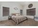 Comfortable bedroom with neutral colored walls, plush carpeting, and ample natural light at 3856 E Encinas Ave, Gilbert, AZ 85234