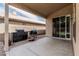 Covered patio with multiple grills and ample space offers an ideal outdoor entertainment area at 3856 E Encinas Ave, Gilbert, AZ 85234