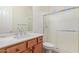 Bathroom featuring a single-sink vanity with a marble countertop and a glass shower at 3886 E Ficus Way, Gilbert, AZ 85298