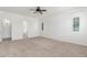 Spacious primary bedroom boasts carpet flooring, plantation shutters, and an en-suite bathroom at 3886 E Ficus Way, Gilbert, AZ 85298