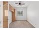 Cozy bedroom features carpet flooring, a built-in cabinet, and a window for natural light at 3886 E Ficus Way, Gilbert, AZ 85298