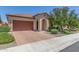 Beautiful single-story home with a paver driveway, two-car garage, and attractive landscaping at 3886 E Ficus Way, Gilbert, AZ 85298
