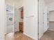 Hallway view leading to a bedroom and closet with built in cabinets and storage at 3886 E Ficus Way, Gilbert, AZ 85298