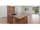 Close-up of the kitchen island featuring granite countertops, sink, and stainless steel dishwasher at 3886 E Ficus Way, Gilbert, AZ 85298