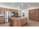 Well-equipped kitchen with stainless steel appliances, granite counters, and a large center island at 3886 E Ficus Way, Gilbert, AZ 85298