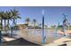 Community splash pad offers a fun and refreshing water play area with vibrant blue water features and nearby shade at 3886 E Ficus Way, Gilbert, AZ 85298