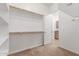 Walk-in closet showcasing multiple levels of shelving and rods for organized storage at 3886 E Ficus Way, Gilbert, AZ 85298