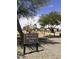 The Bridges at Gilbert Woodland Park sign with playground and covered seating area in the background at 3886 E Ficus Way, Gilbert, AZ 85298