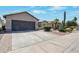 A well-maintained house boasting a spacious driveway and desert-style landscaping at 3925 N 160Th Ave, Goodyear, AZ 85395