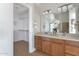 Charming main bathroom features double sinks, ample counter space, and a view into the walk-in closet at 3925 N 160Th Ave, Goodyear, AZ 85395
