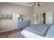 Inviting main bedroom with a closet, a ceiling fan, a dresser, and a bathroom for comfort and convenience at 3925 N 160Th Ave, Goodyear, AZ 85395