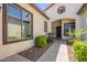Inviting front entrance with a covered walkway, desert landscaping, and a stylish front door at 3971 E Leo Pl, Chandler, AZ 85249
