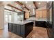 Modern kitchen featuring a large island, stainless steel appliances, and stylish lighting fixtures at 3971 E Leo Pl, Chandler, AZ 85249