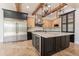 Stylish kitchen featuring a large island with seating, stainless steel appliances, and custom cabinetry at 3971 E Leo Pl, Chandler, AZ 85249