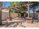 Beautiful outdoor fireplace and pergola for relaxing and entertaining on a paver patio at 3971 E Leo Pl, Chandler, AZ 85249