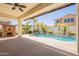 Outdoor patio featuring a covered area, in-ground pool, and lush landscaping for relaxation at 3971 E Leo Pl, Chandler, AZ 85249