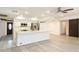 Bright, open kitchen featuring a large island, stainless appliances and white cabinets at 4628 W Solano S Dr, Glendale, AZ 85301