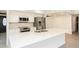 Upgraded kitchen showcasing a large island with quartz countertops and stainless steel appliances at 4628 W Solano S Dr, Glendale, AZ 85301
