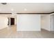 Open-concept living area with light wood-look floors and views to multiple rooms at 4628 W Solano S Dr, Glendale, AZ 85301