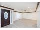 Large living area with new floors, modern trim, and a decorative glass front door at 4628 W Solano S Dr, Glendale, AZ 85301