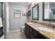 Bright bathroom featuring double sinks with granite countertops and modern fixtures at 4704 E Melinda Ln, Phoenix, AZ 85050