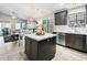 Open kitchen with modern appliances, island, and adjacent living area, perfect for entertaining at 4704 E Melinda Ln, Phoenix, AZ 85050