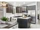 Well-equipped kitchen with stainless steel appliances, bright countertops and dark wood cabinets at 4704 E Melinda Ln, Phoenix, AZ 85050
