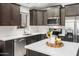 Stylish kitchen features stainless appliances, granite countertops, and plenty of cabinet space at 4704 E Melinda Ln, Phoenix, AZ 85050